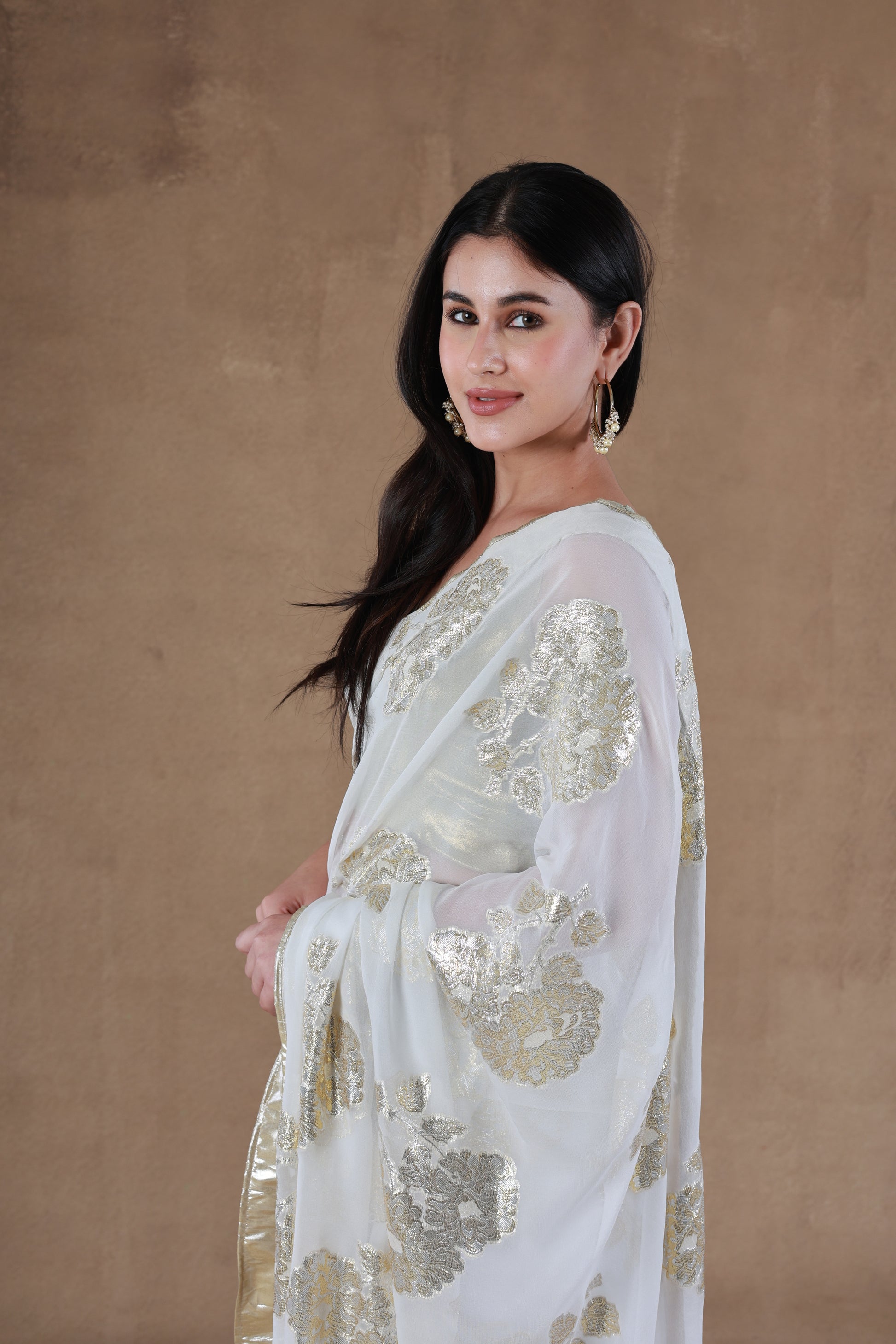 Model in Slay Official Aurora Gold Foil Saree designed by Simar, showcasing a left side pose.